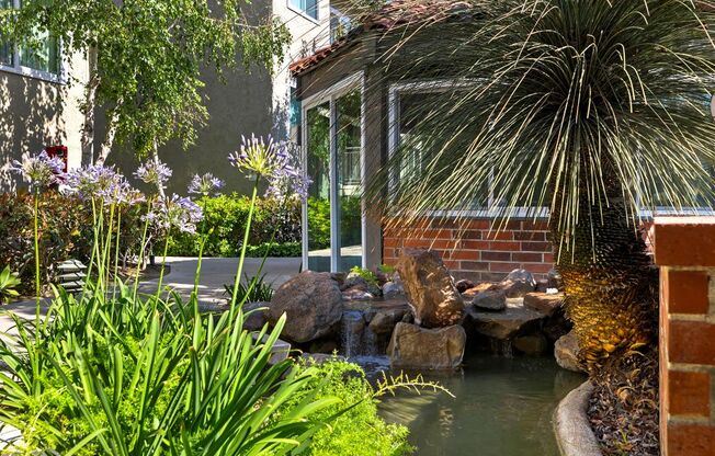 a small pond in front of a building