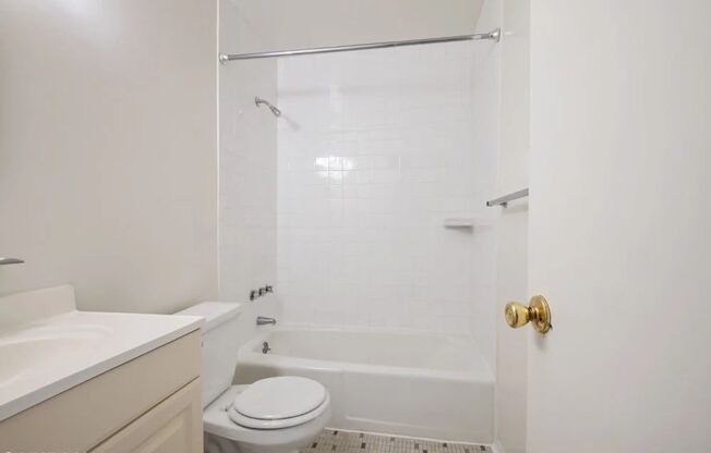 Bright white bathroom with full tub
