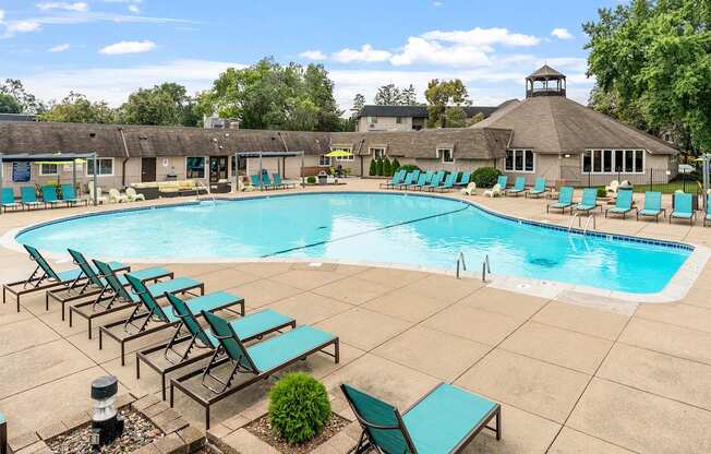 large outdoor pool with lounge chairs