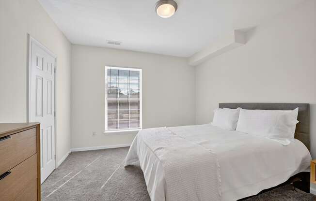 A classic style bedroom with bed and dresser
