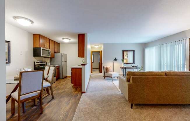 a living room with a couch a chair and a table