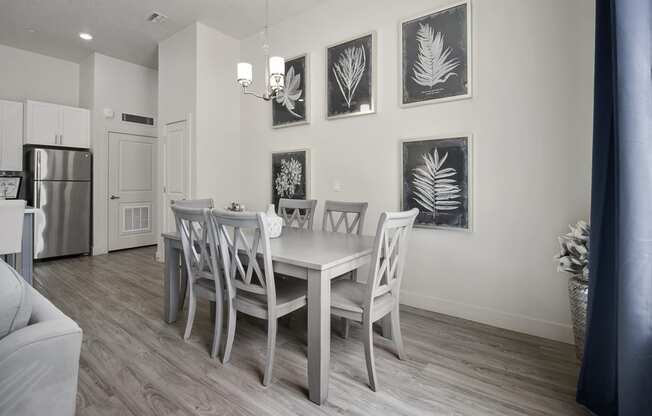 a dining room with a table and chairs at 200 City View, Provo