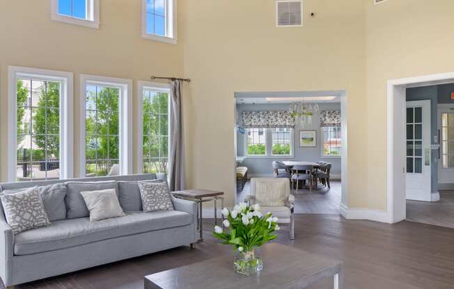 a living room filled with furniture and a large window