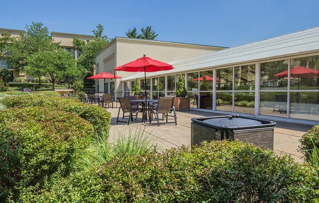 Outdoor Lounge With Umbrella Shades at Stuart Woods, Herndon, Virginia