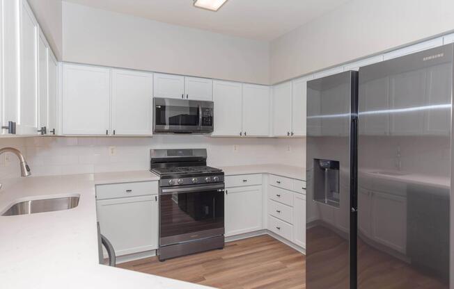 a kitchen with stainless steel appliances