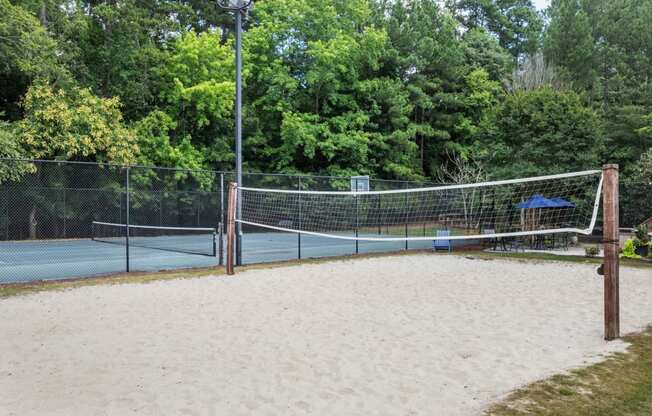 the sand volleyball court with the basketball/tennis court in the background