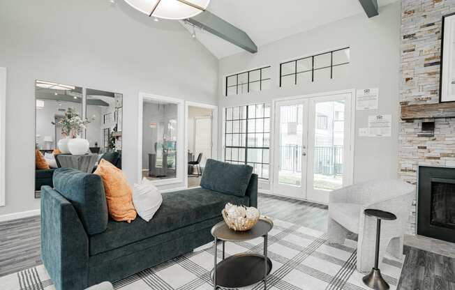 an open living room with a couch and a fireplace