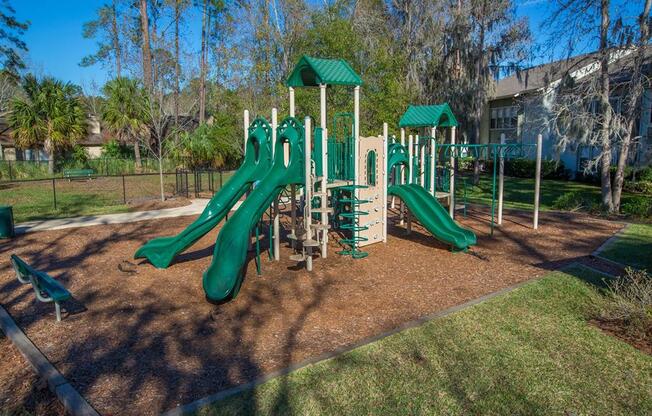 Playground with seating area at Creekfront at Deerwood, Jacksonville, 32256