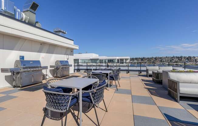 a terrace with tables and chairs on the top of a building at Marina Square, Bremerton, 98337