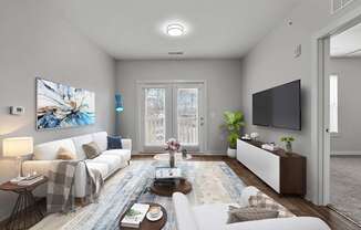 A modern living room with a white sofa, a coffee table, and a painting on the wall.