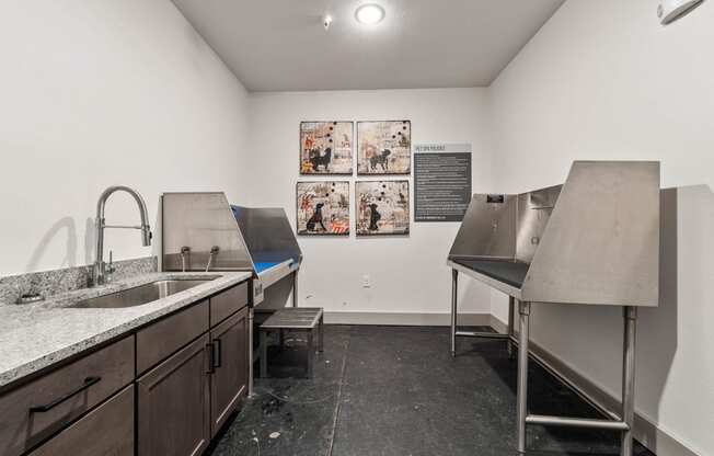a kitchen with two stainless steel sinks and a counter top