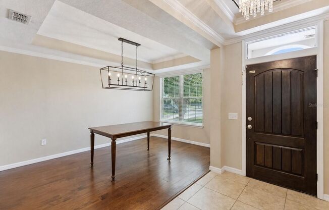 This spacious and charming 7-bedroom, 4.5-bathroom single-family home is located at 8701 Iron Mountain Trail Windermere, Florida 34786