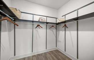 Spacious walk-in closet with built-in shelving and plenty of room for organized storage