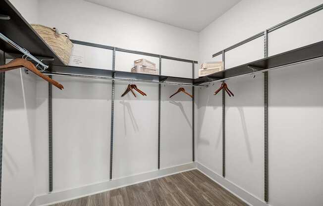 Spacious walk-in closet with built-in shelving and plenty of room for organized storage