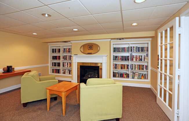 a living room filled with furniture and a fireplace