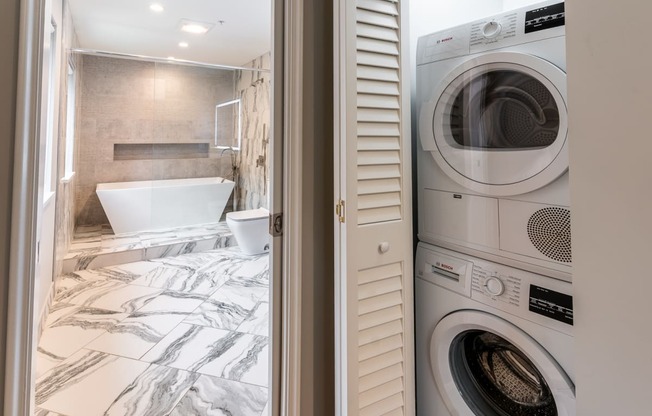 a small laundry room with a washer and dryer