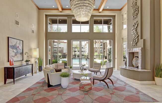 a large living room with a fireplace and large windows