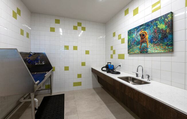 a kitchen with a sink and a painting on the wall at Sinclaire on Seminary, Virginia, 22311