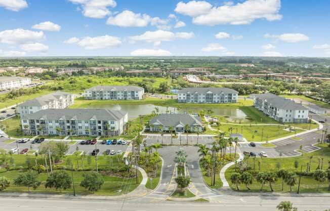 an aerial view of a community with houses and a lake