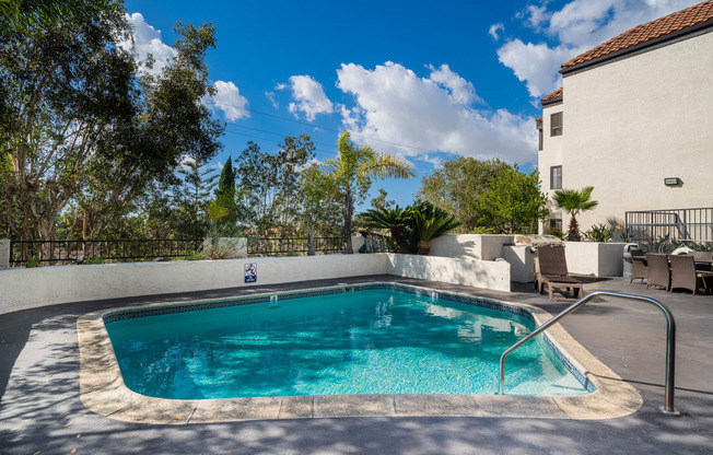 Swimming pool with view of sky and clouds