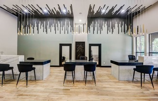 a dining room with a table and chairs and a lobby with large windows