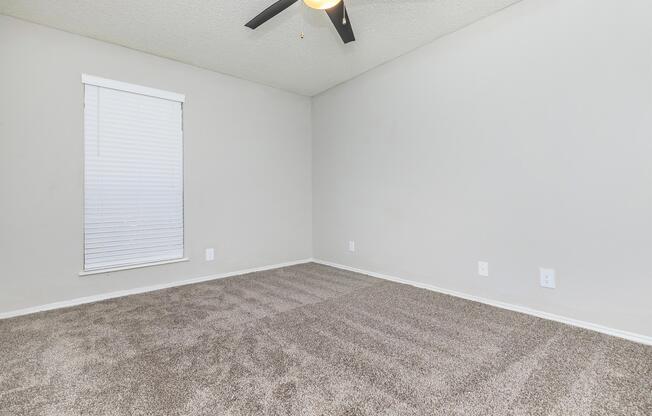 a bedroom with a large mirror