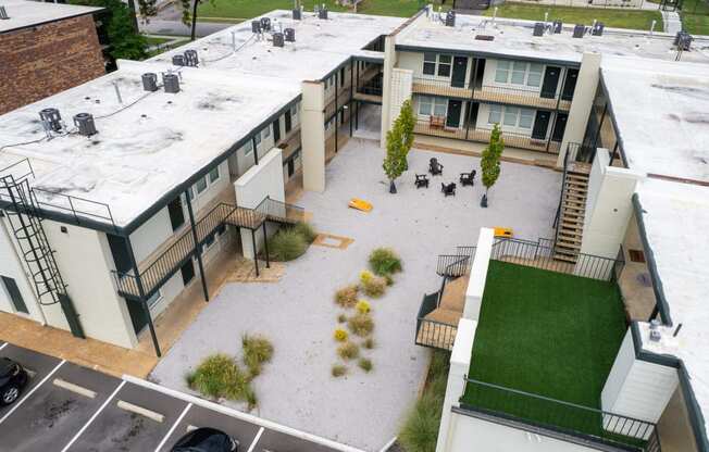 an aerial view of the courtyard of a building with green grass at The Courts Midtown, Memphis, TN