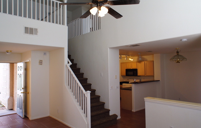 THIS IS A CHARMING TWO-STORY NORTH LAS VEGAS HOME WITH 2 BEDROOMS, 2.5 BATHS AND A TWO-CAR ATTACHED GARAGE. FEATURING TILE AND CARPET FLOORING, NEUTRAL PAINT, AND BLINDS THROUGHOUT, THE MAIN LEVEL OFFERS AN OPEN LIVING AND DINING AREA THAT FLOWS INTO A KI