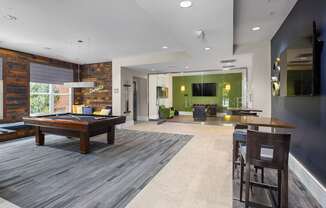A modern living room with a wooden table and chairs.