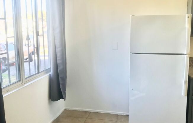 Downstairs 2 Bedroom Apartment Unit With Stove and Refrigerator Included!