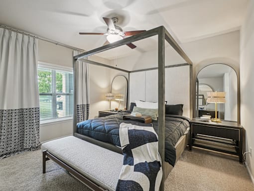 Luxury apartment bedroom with modern finishes at Village at Broadstone Station in Apex, NC