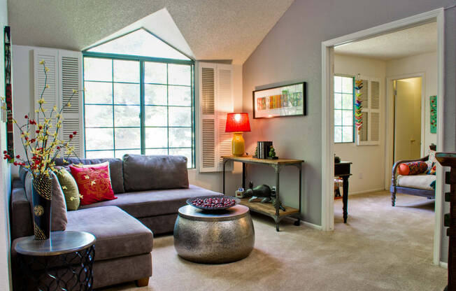 a living room with a couch and a table