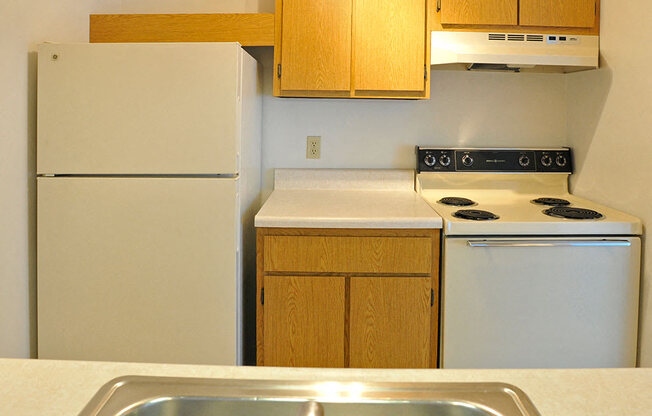 White Appliances in Kitchen at Charter Oaks Apartments, Davison, 48423