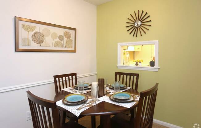 a dining room with a table and chairs