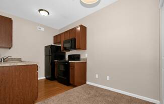 a kitchen and living room in a 555 waverly unit