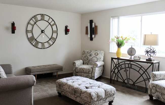 a living room with a large clock on the wall