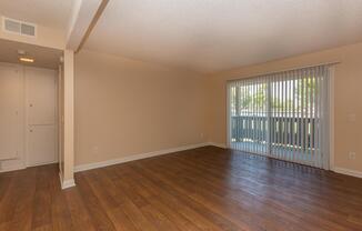 a large empty room with a wood floor