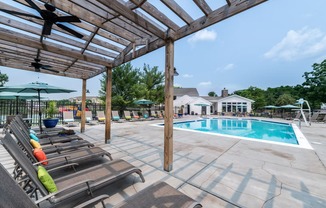 take a dip in the pool at villas at houston levee west apartments in cord at Misty Ridge Apartments, Woodbridge, VA 22191