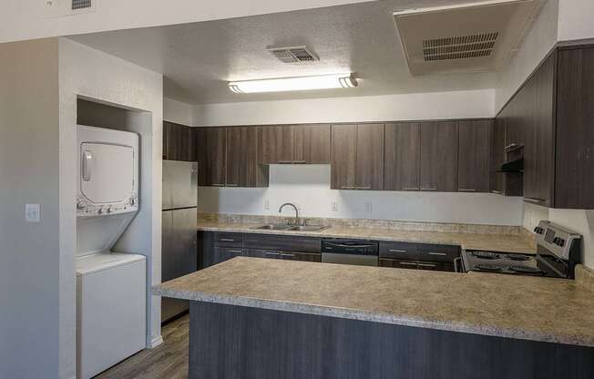 a kitchen with a counter top and a sink