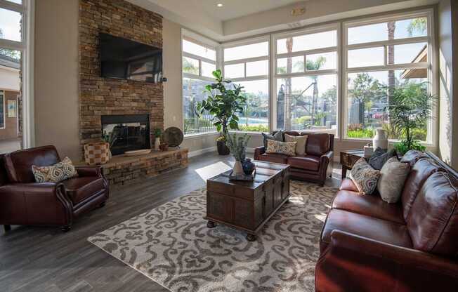 A living room with a fireplace and a television.