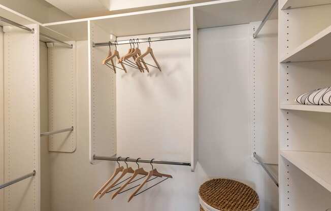 a walk in closet with hooks and a white wall at The Rays at Vegas Towers Apartments, Las Vegas, NV 89119