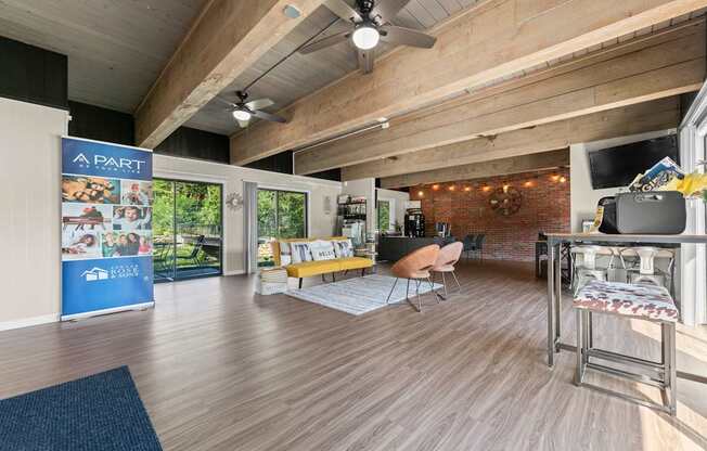 A room with wooden floors and a ceiling fan.