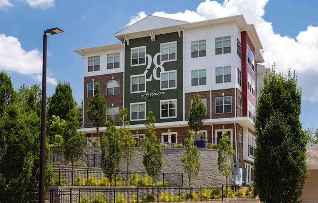 A modern apartment building with the number 28 on the front.