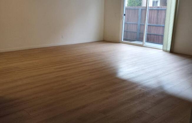 Living Room with Hardwood Floors and Patio Door