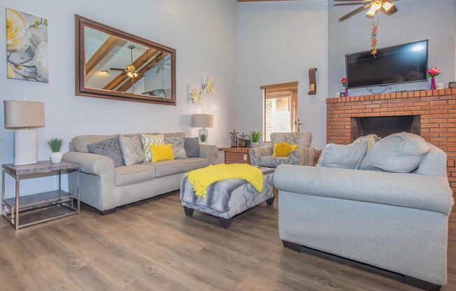 a living room filled with furniture and a fireplace