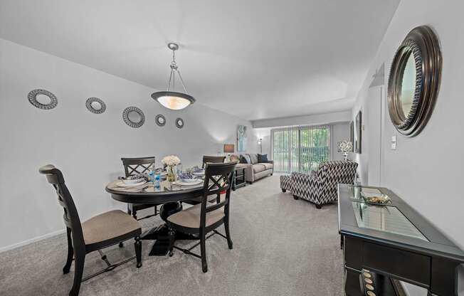 Spacious living/dining room with natural light at Westwood Village Apartments in Westland, MI