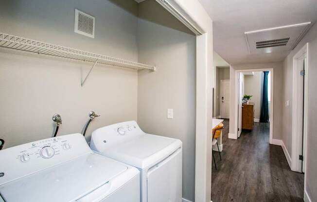 A laundry room with a washer and dryer. at Octave Apartments, Las Vegas