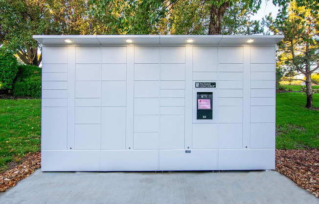 A white garage door with a sign on it.
