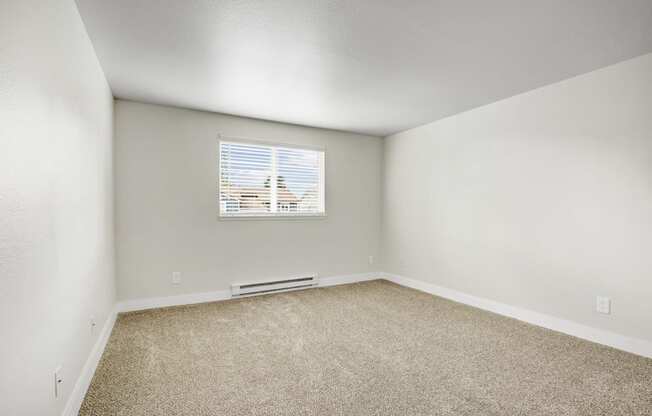 an empty room with white walls and a window at 2000 Lake Washington Apartments, Renton, 98056