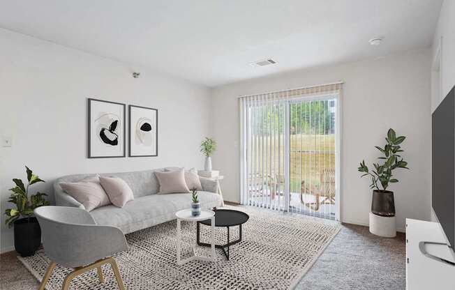 2 & 3-Bedroom Apartments for Rent in Little Rock, AR – Capitol Hill – A living room with a grey couch, a grey chair, a black and white coffee table, and a large window with blinds.